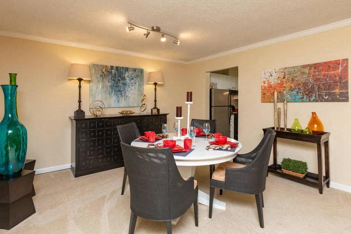 a dining room with a table and chairs