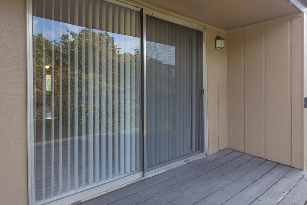 the sliding glass door is open to the patio
