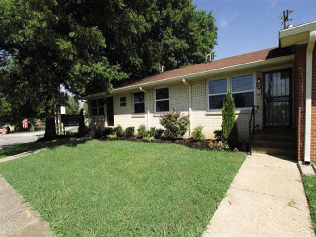 a house with a lawn in front of it