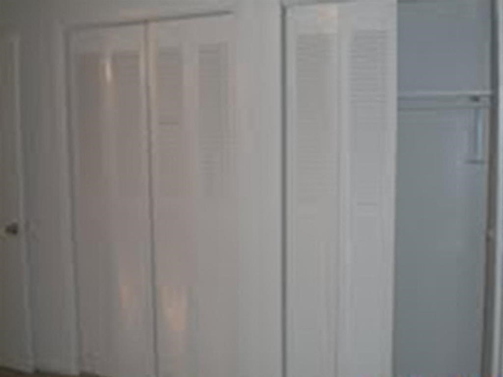 a white wall with white doors