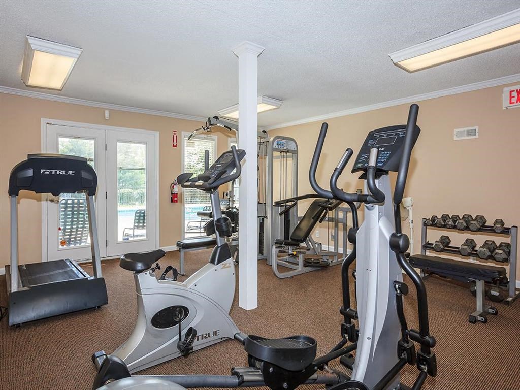 a gym with a lot of equipment in it