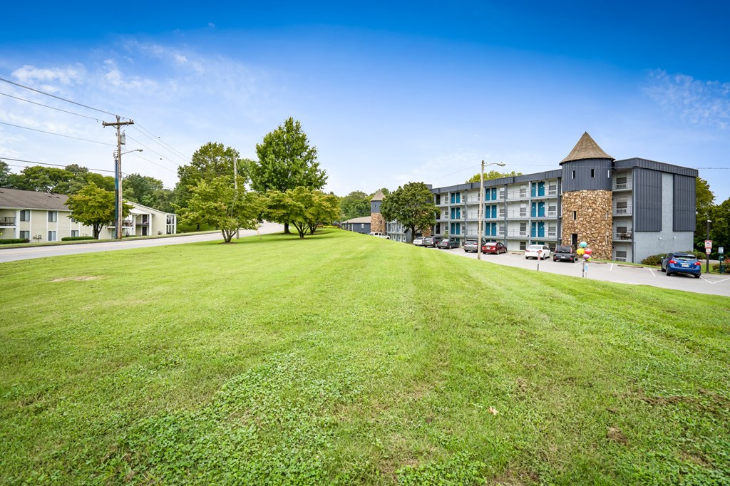 a large green lawn in front of a building