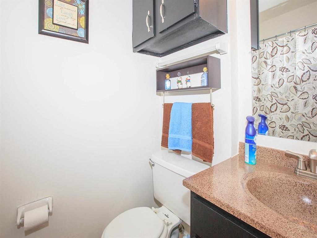 a bathroom with a toilet and a sink