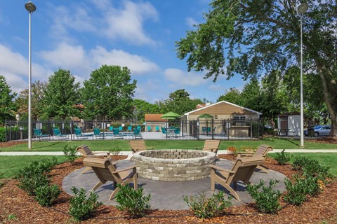 the preserve at ballantyne commons clubhouse with a fire pit and picnic tables