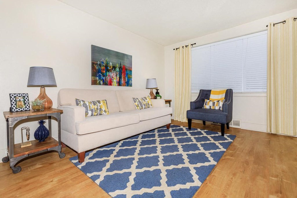 a living room with a couch and a chair