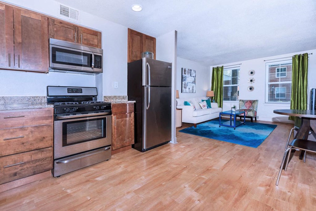 a kitchen with stainless steel appliances and a refrigerator