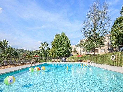 a swimming pool with colorful balls in it