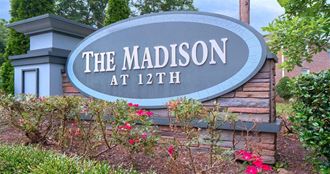 a sign for the madison at 12th
