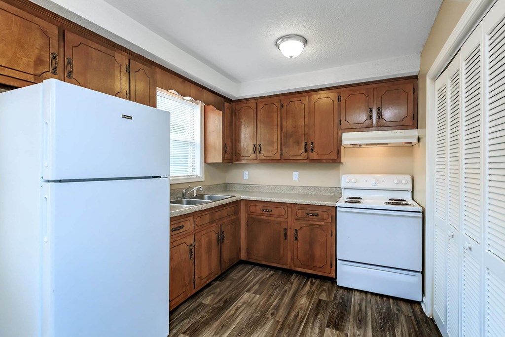full kitchen with white appliances and wooden cabinets