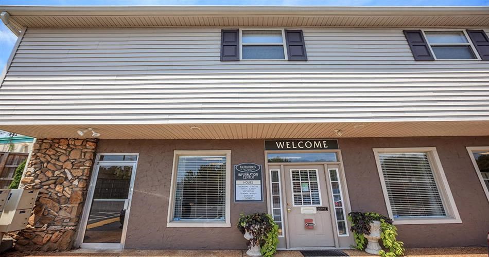a building with a welcome sign in front of it