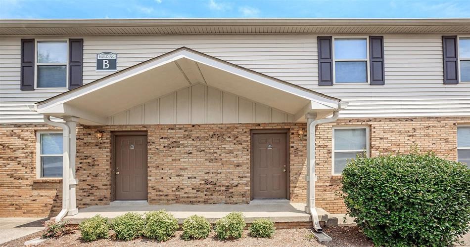 a building with two doors and a brick wall
