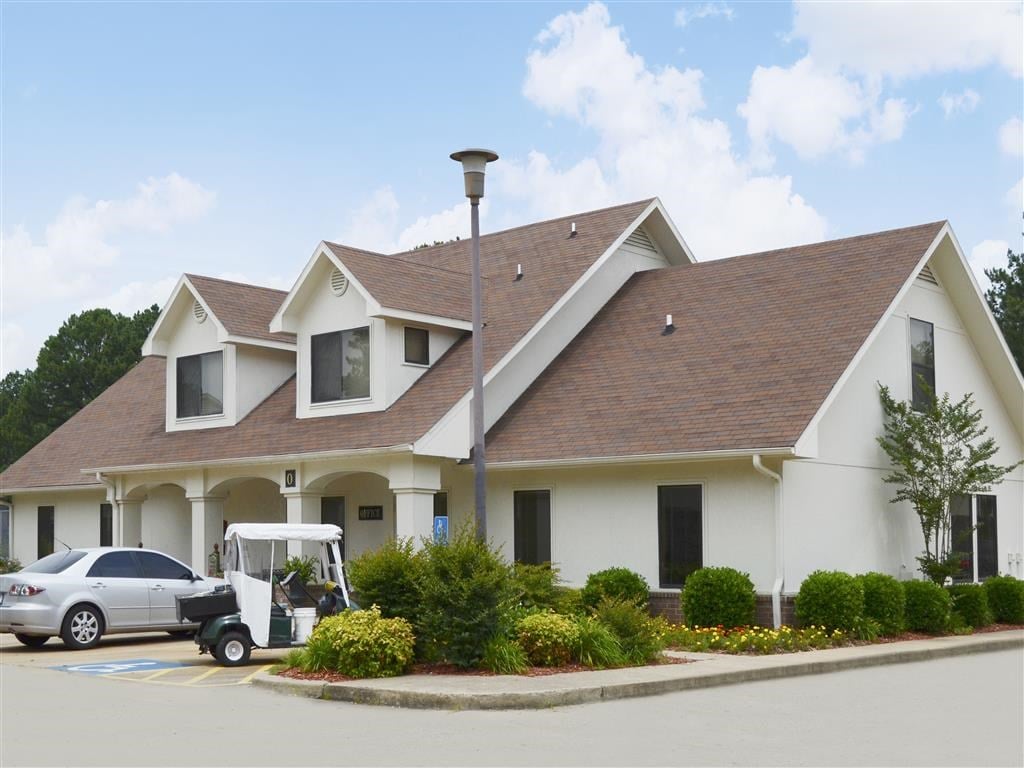 a house with a golf cart parked in front of it