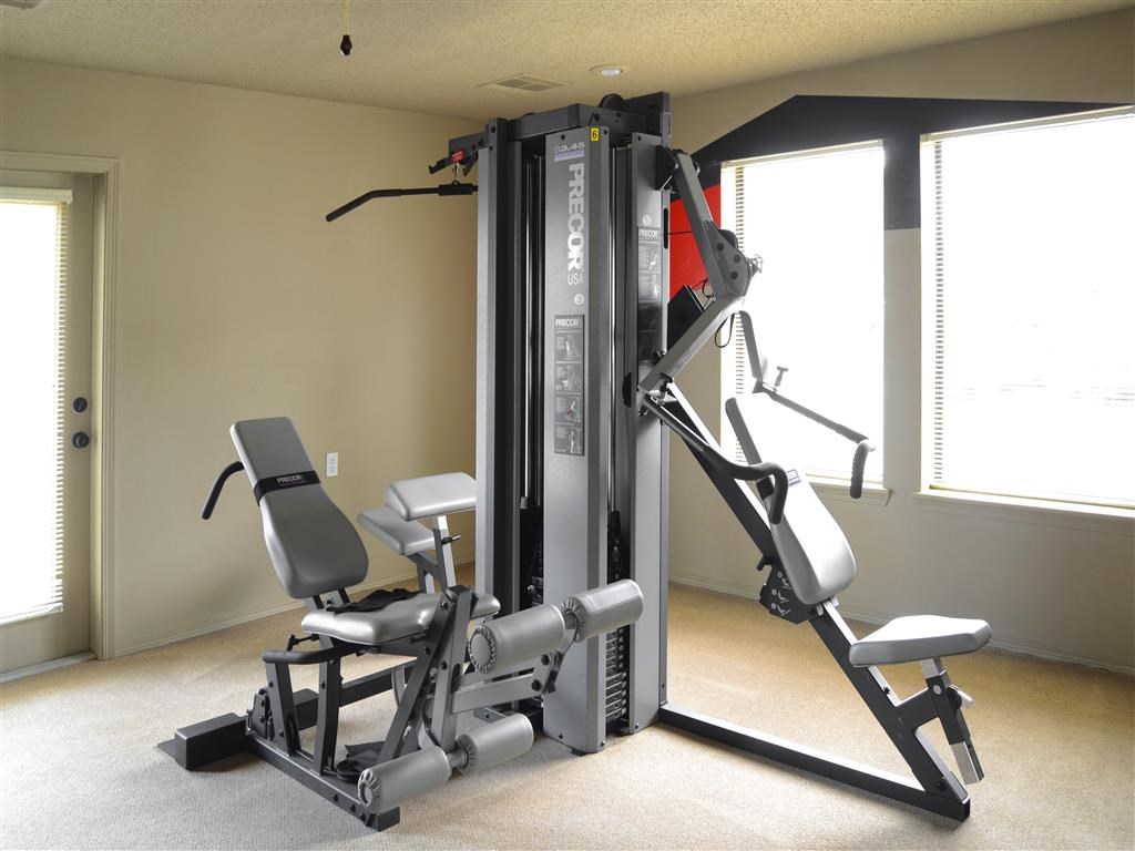 a gym with a exercise machine in a room