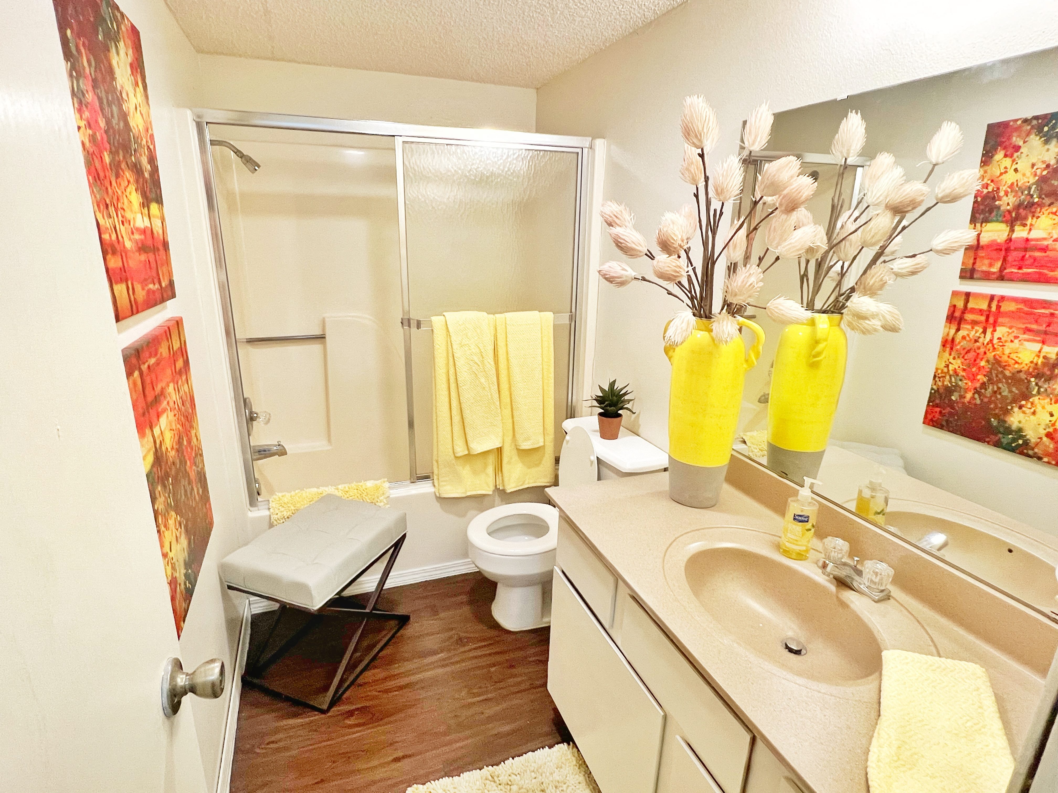 a bathroom with a sink and a toilet and a shower