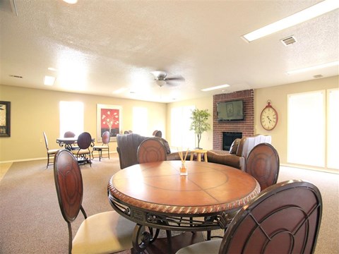 a dining room with a table and chairs