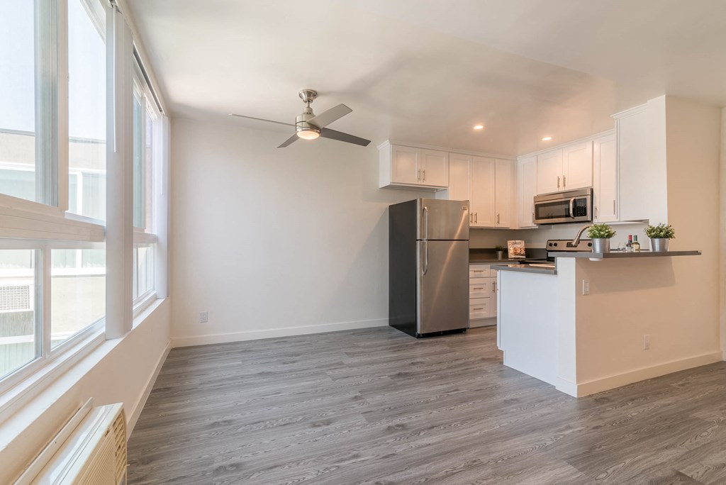 Dining area with kitchen and large window view