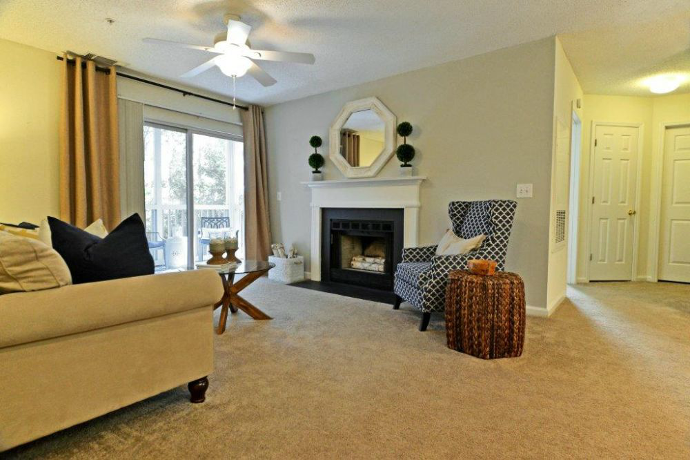 a living room with a couch and a fireplace
