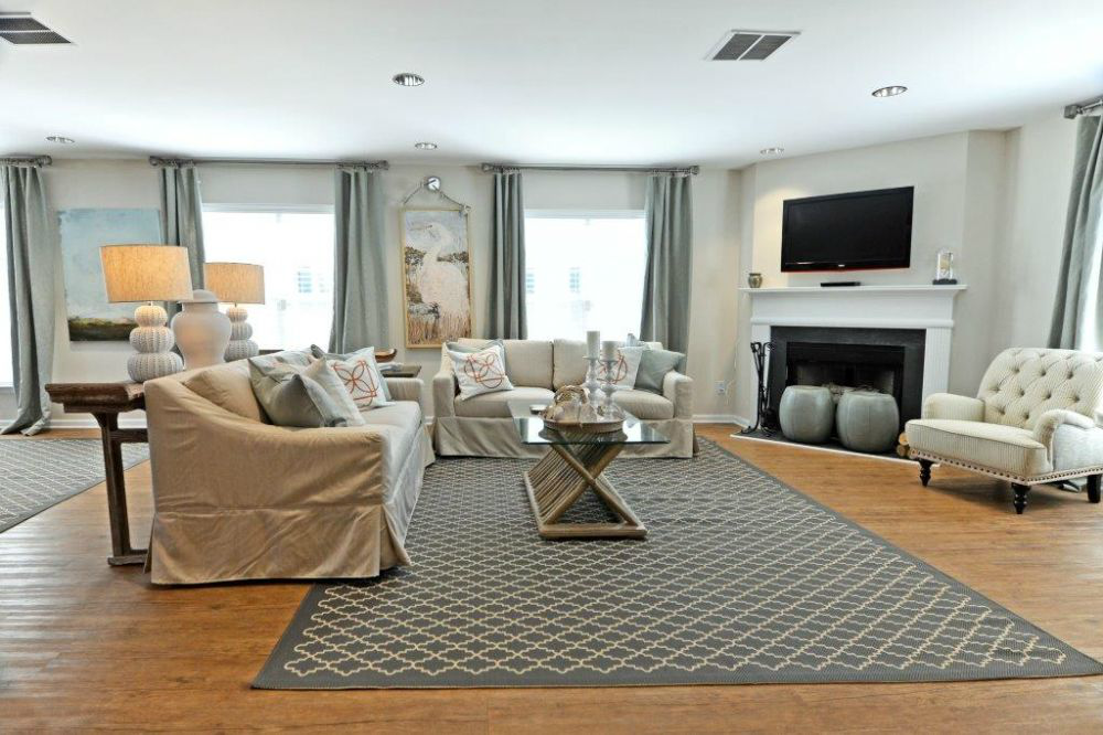 a living room filled with furniture and a fire place