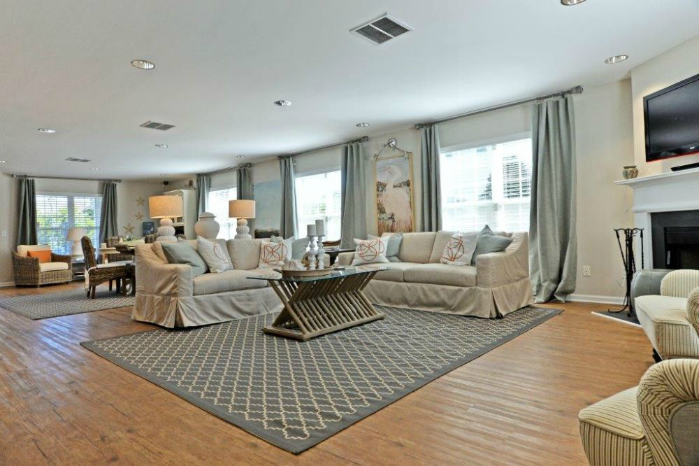 a living room with couches and chairs and a fireplace