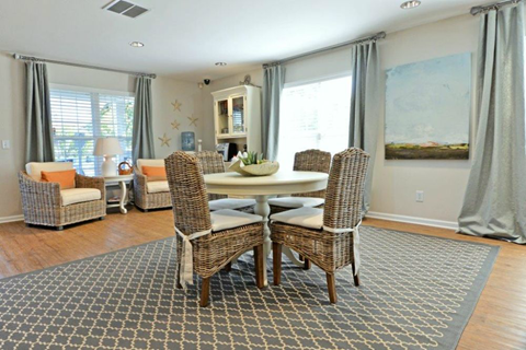 a dining room with a table and chairs