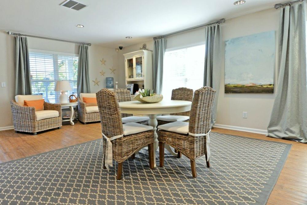 a dining room with a table and chairs