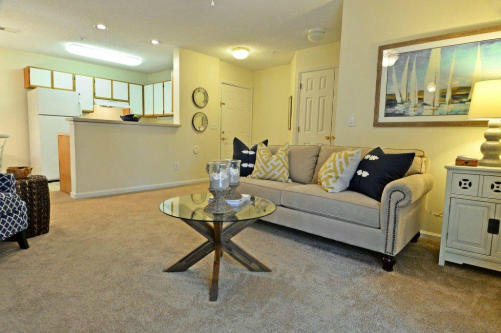 a living room with a couch and a table