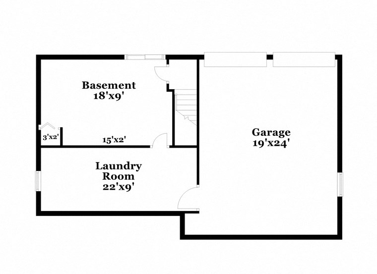 floor plan of the first floor of a house with a bedroom and a laundry room