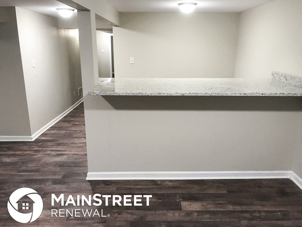 a white wall with a counter top in a house