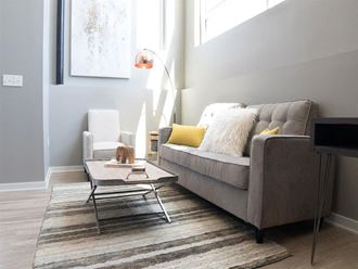 a living room with a couch and a chair
