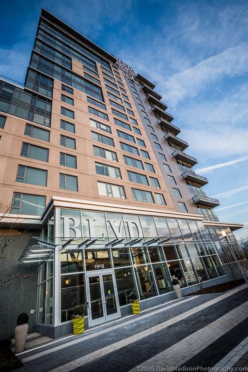 a tall building with a blue sky in the background