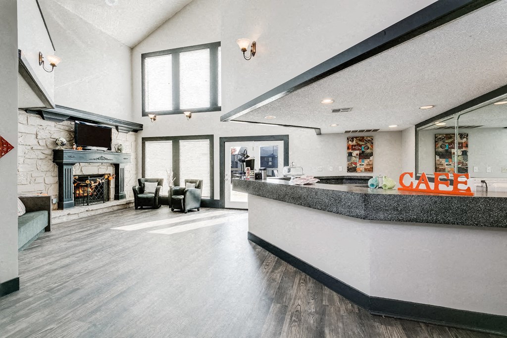 a lobby with a counter and a fireplace