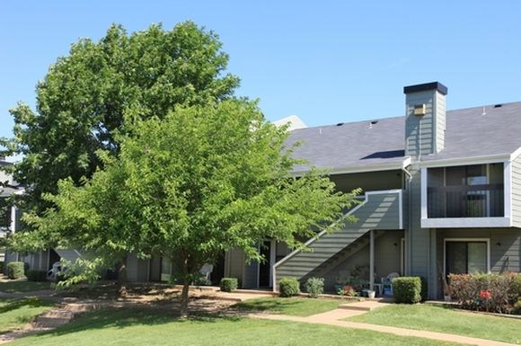 a building with a tree in front of it