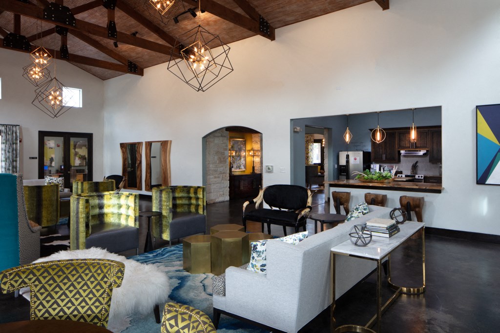 a living room with couches and chairs and a table