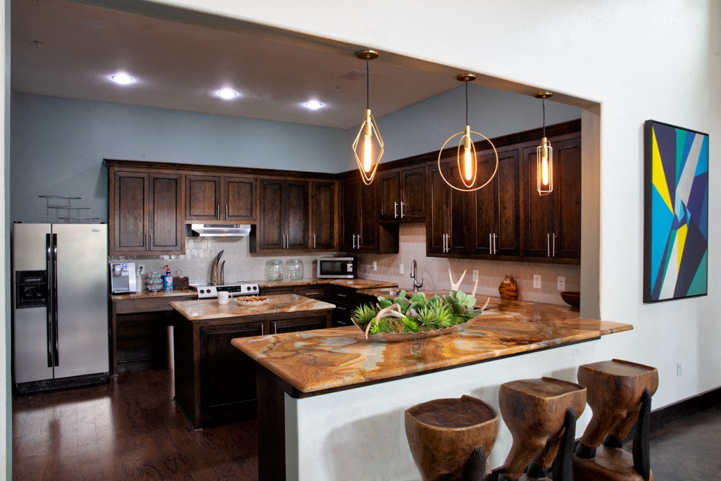 a kitchen with wooden cabinets and a counter top
