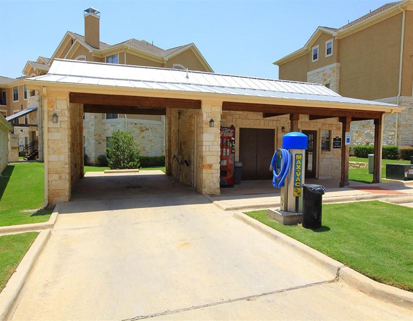 a gas station with a covered parking lot