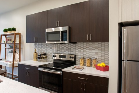 a kitchen with a stove and a microwave
