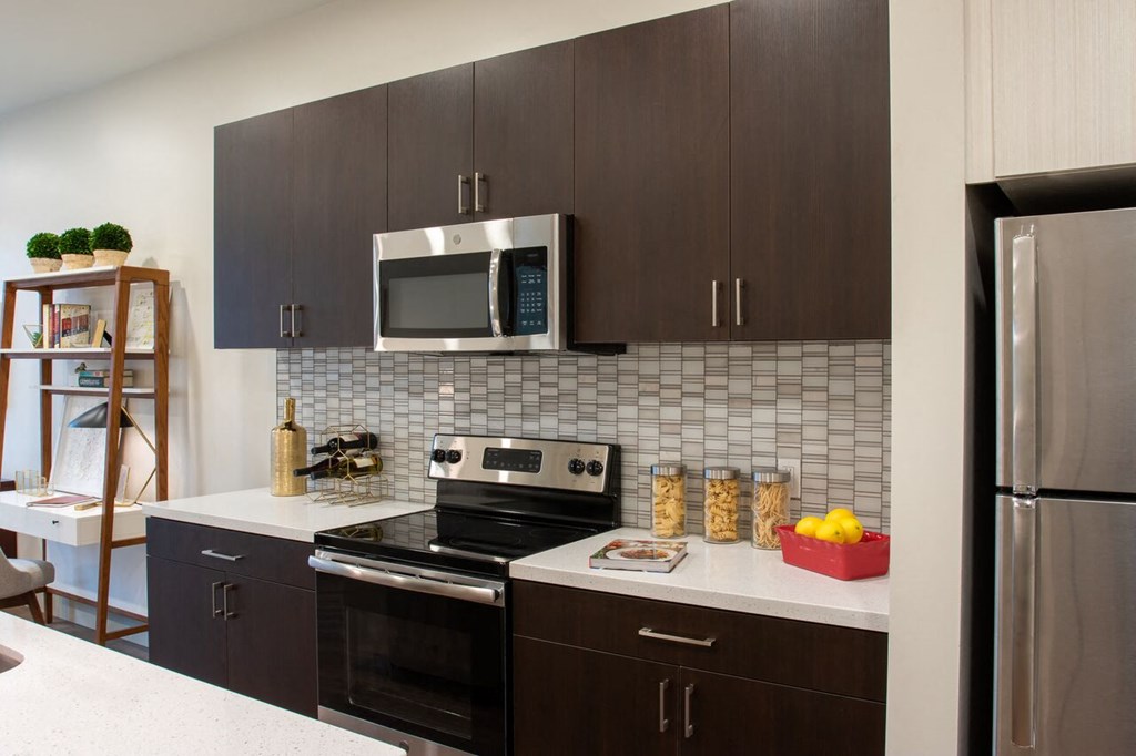 a kitchen with a stove and a microwave