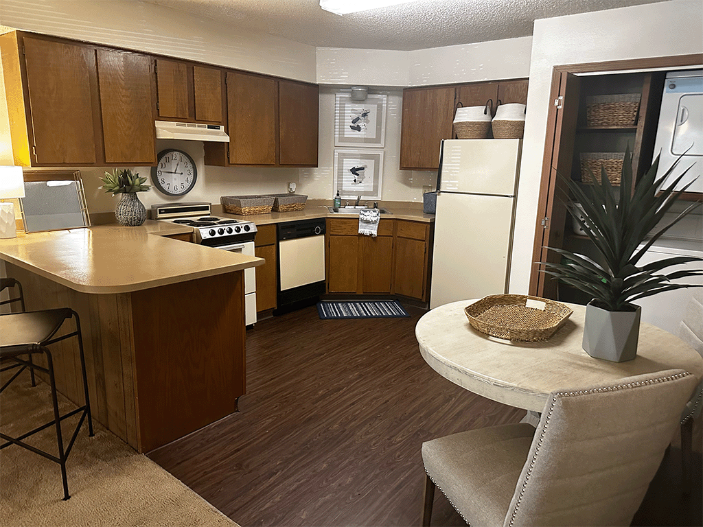 a kitchen with a counter top and a refrigerator