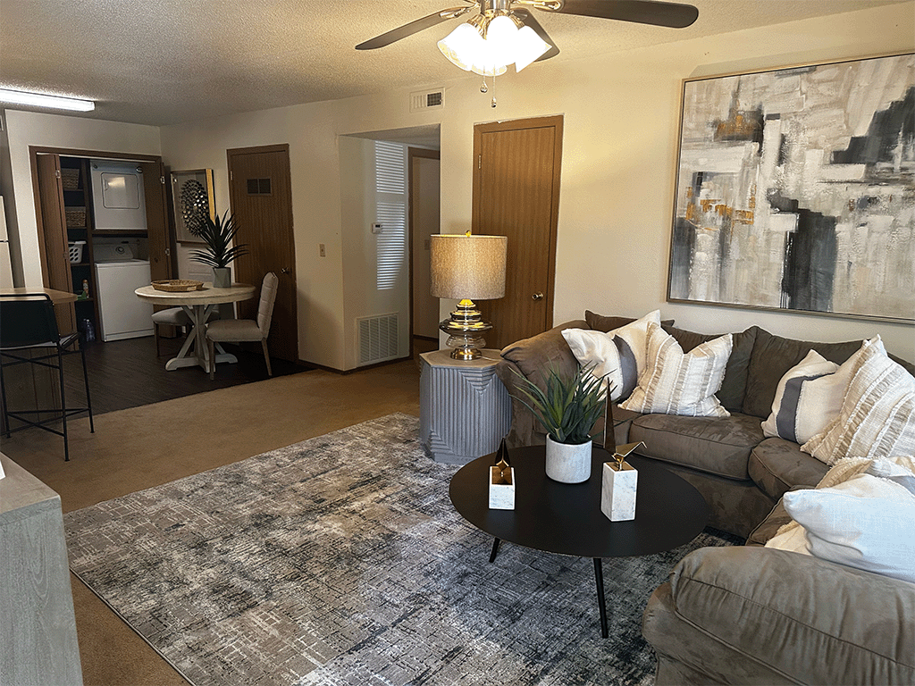 a living room with couches and a coffee table