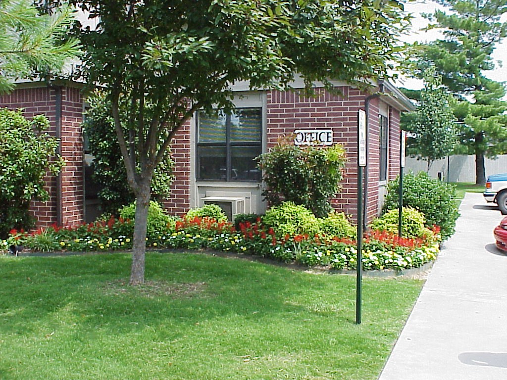 a street sign in front of a brick building