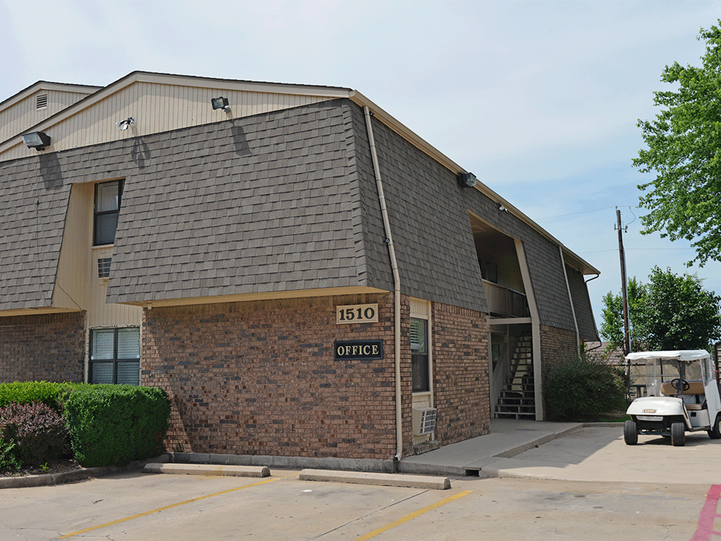 an office building with a truck parked outside