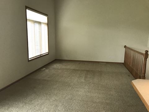 Carpeted Living Area at Tustin Townhomes, Fargo, 58104
