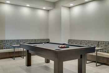 Residents can enjoy a good game of pool in the party room at Ascend at Woodbury in Woodbury, MN