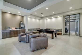 Residents can enjoy a good game of pool in the party room at Ascend at Woodbury in Woodbury, MN