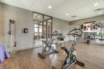 Bicycling machines in the spacious 24 hour fitness center at Ascend at Woodbury in Woodbury, MN