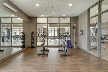 Bicycling machines in the spacious 24 hour fitness center at Ascend at Woodbury in Woodbury, MN