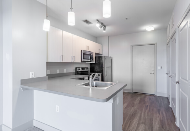 Kitchen with cabinets and white interior at Canalside, Augusta, Georgia