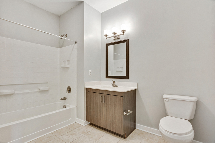 a bathroom with a toilet sink and a shower
