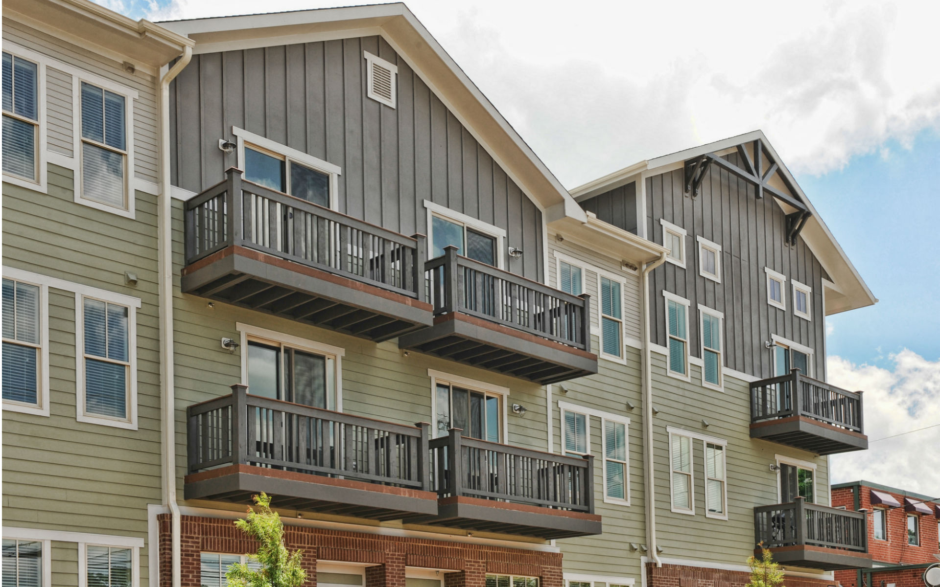 a row of apartment buildings with balconies