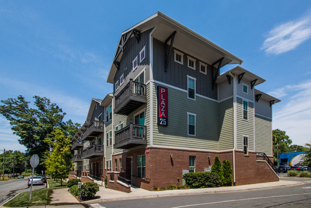an apartment building on the corner of a street